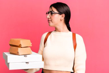 on profile view thinking, imagining or daydreaming. fast food delivery or take away