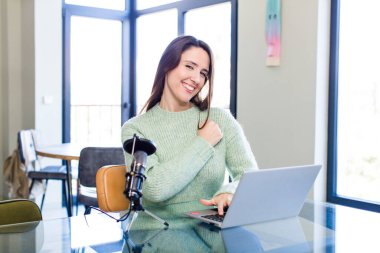 young pretty woman feeling happy and facing a challenge or celebrating. influencer concept