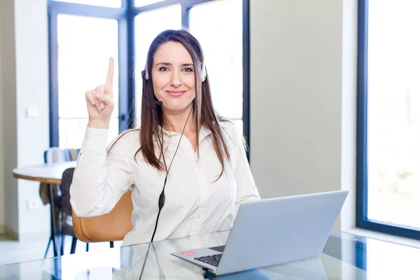 Young Pretty Woman Smiling Looking Friendly Showing Number One Telemarketer — Stock Photo, Image