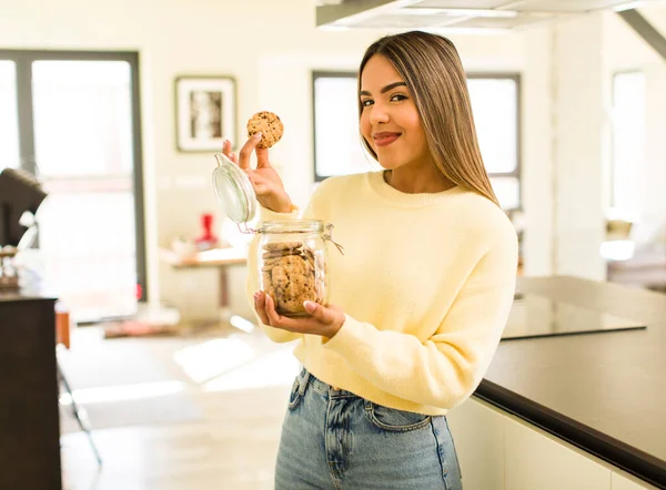pretty latin woman with home made cookies bottles