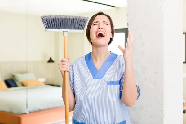 Young Pretty Woman Looking Desperate Frustrated Stressed Housekeeper Concept — kuvapankkivalokuva