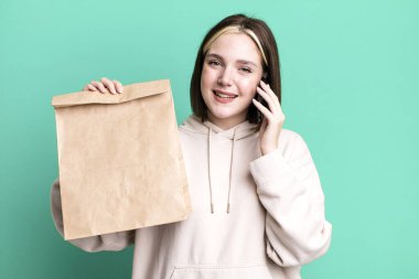 young pretty woman with a take away paper bag