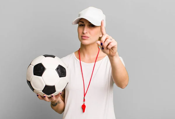 young pretty woman soccer coach concept
