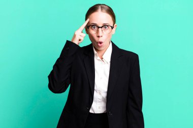 caucasian pretty woman looking surprised, realizing a new thought, idea or concept. business concept