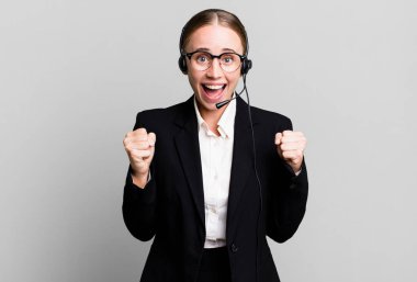 caucasian pretty woman feeling shocked,laughing and celebrating success. telemarketing concept