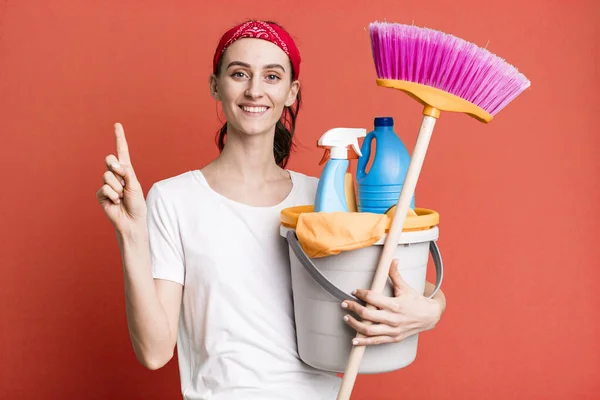 Young Pretty Woman Smiling Looking Friendly Showing Number One Housekeeper — Stockfoto