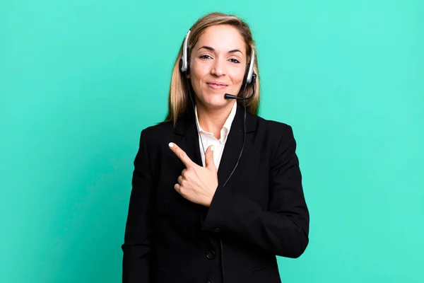 Pretty Blonde Woman Smiling Cheerfully Feeling Happy Pointing Side Telemarketing — Stockfoto