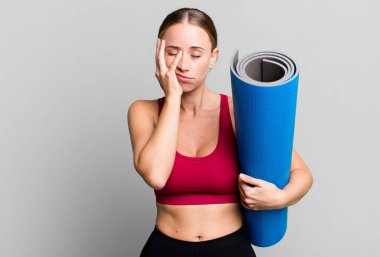 caucasian pretty woman feeling bored, frustrated and sleepy after a tiresome. fitness and yoga concept