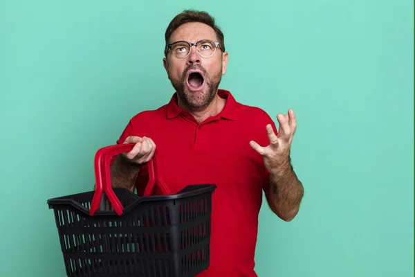 Middle Age Man Looking Desperate Frustrated Stressed Empty Shopping Basket — Stok fotoğraf