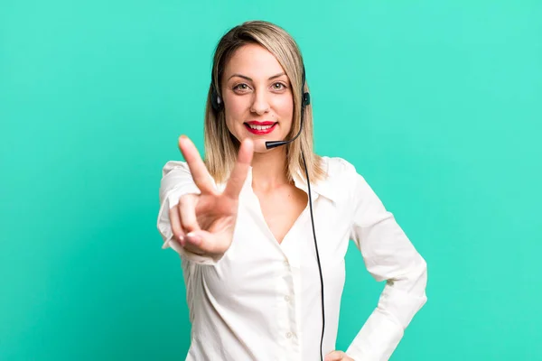 Pretty Blonde Woman Smiling Looking Happy Gesturing Victory Peace Telemarketer — Stockfoto