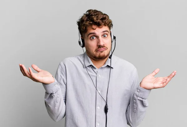 Young Adult Caucasian Man Feeling Puzzled Confused Doubting Telemarketer Agent — Stockfoto