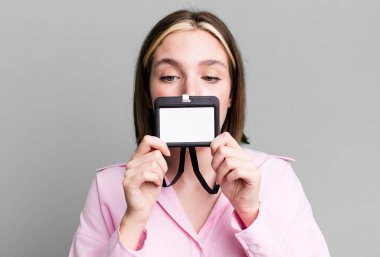 young pretty woman with an accreditation pass id