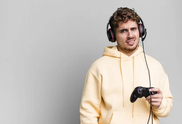 Young Adult Caucasian Man Feeling Puzzled Confused Headset Controller Gamer — Stockfoto