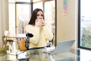 young pretty influencer woman telecommuting at home