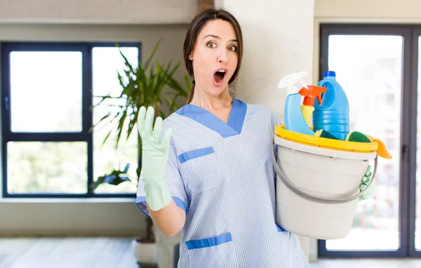 Young Pretty Woman Feeling Extremely Shocked Surprised Housekeeper Concept — Stok fotoğraf