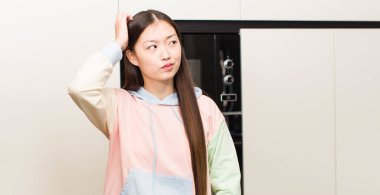 asian pretty woman at new home kitchen