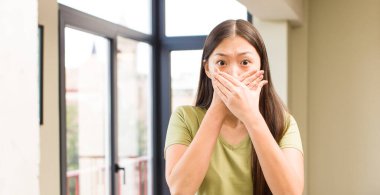 asian pretty woman at home with big windows background