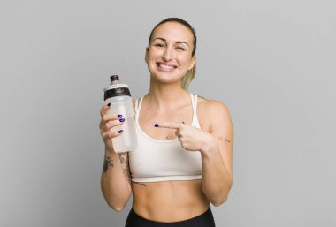 young pretty woman with water bottle. fitness concept