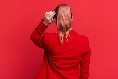 young pretty businesswoman wearing red blazer