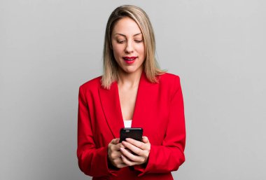 young pretty businesswoman using her smart phone