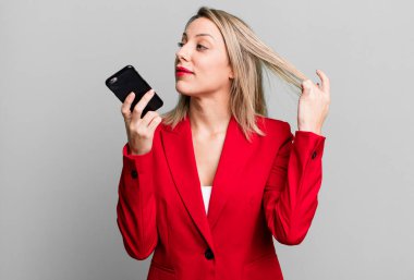 young pretty businesswoman using her smart phone