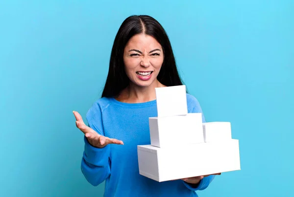 Hispanic Pretty Woman Looking Angry Annoyed Frustrated White Boxes Packagings — Zdjęcie stockowe