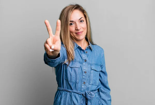 Blonde Adult Woman Smiling Looking Happy Carefree Positive Gesturing Victory — Stock Photo, Image