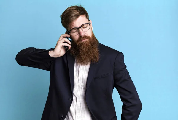 Young Adult Red Hair Bearded Cool Businessman Using His Smartphone — Stock Photo, Image