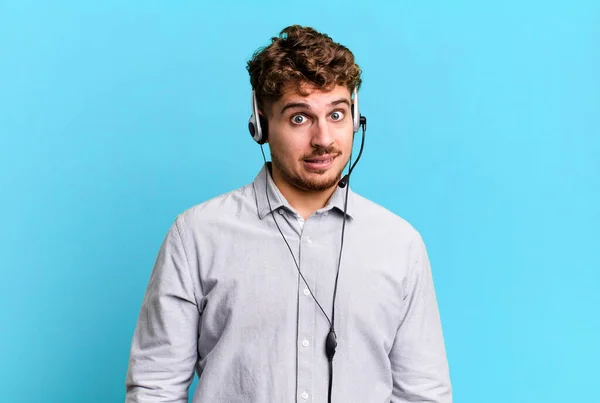 Young Adult Caucasian Man Looking Puzzled Confused Telemarketer Agent Concept — Fotografia de Stock