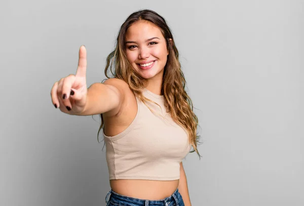 Young Pretty Woman Smiling Proudly Confidently Making Number One Pose — Stock Photo, Image