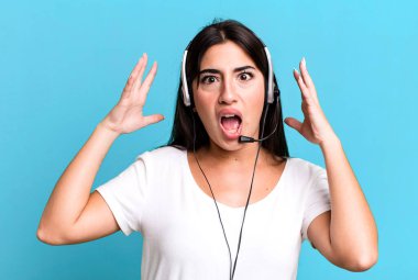 screaming with hands up in the air. telemarketer concept
