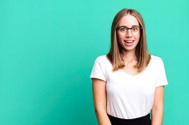 pretty blonde woman presenting a concept with a copy space