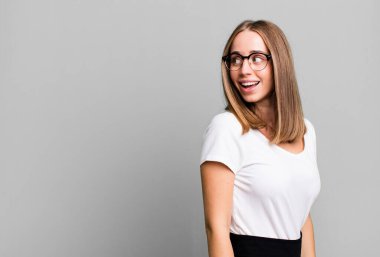 pretty blonde woman presenting a concept with a copy space