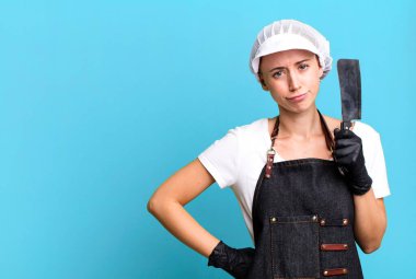 pretty blonde woman butcher concept with a copy space