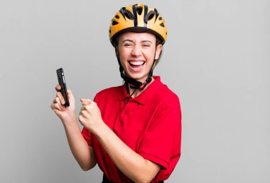 delivery pretty blonde woman with a smartphone