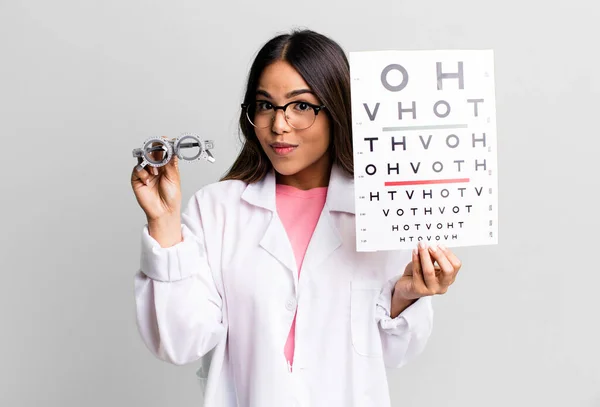 Hispanic Pretty Young Adult Woman Optical Vision Test Concept — Zdjęcie stockowe
