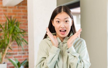 asian pretty woman at new home interior