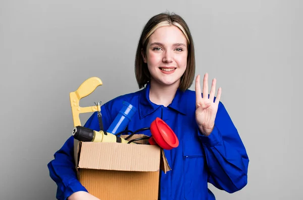 Young Pretty Woman Smiling Looking Friendly Showing Number Four Housekeeper — Stock Photo, Image