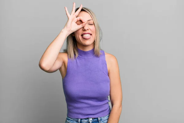 Blonde Adult Woman Smiling Happily Funny Face Joking Looking Peephole — Stockfoto
