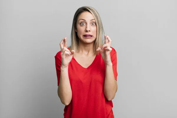 Blonde Adult Woman Crossing Fingers Anxiously Hoping Good Luck Worried — Foto Stock