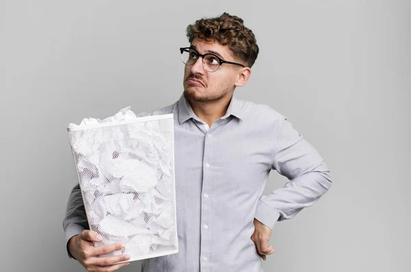 Young Adult Caucasian Man Shrugging Feeling Confused Uncertain Paper Balls — Stock Photo, Image