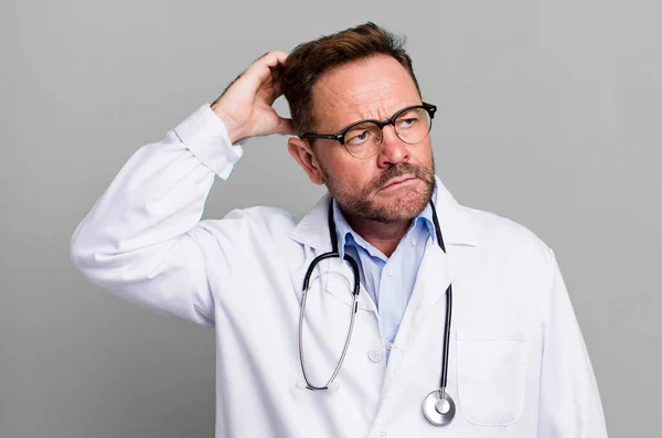 Middle Age Man Feeling Puzzled Confused Scratching Head Physician Concept — Stock Photo, Image