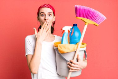 young pretty woman looking very shocked or surprised. housekeeper concept