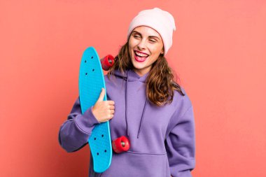 hispanic pretty young woman. skateboard concept