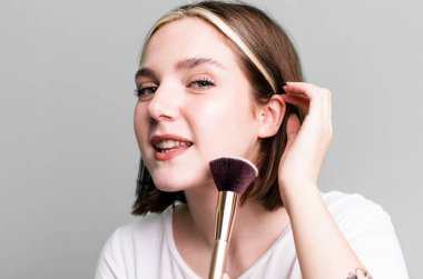 young pretty woman making up concept