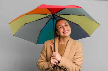 young pretty woman holding an umbrella