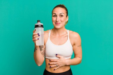 young pretty woman with water bottle. fitness concept