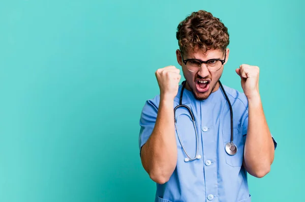 Young Adult Caucasian Man Shouting Aggressively Angry Expression Nurse Concept — Stock Photo, Image