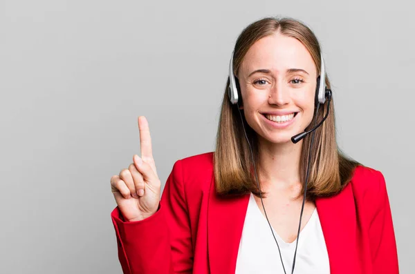 Smiling Looking Friendly Showing Number One Telemarketer Concept — стоковое фото