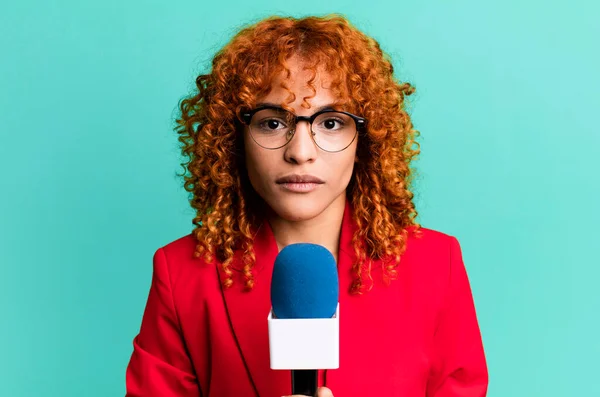 red hair pretty journalist or presenter woman with a micro